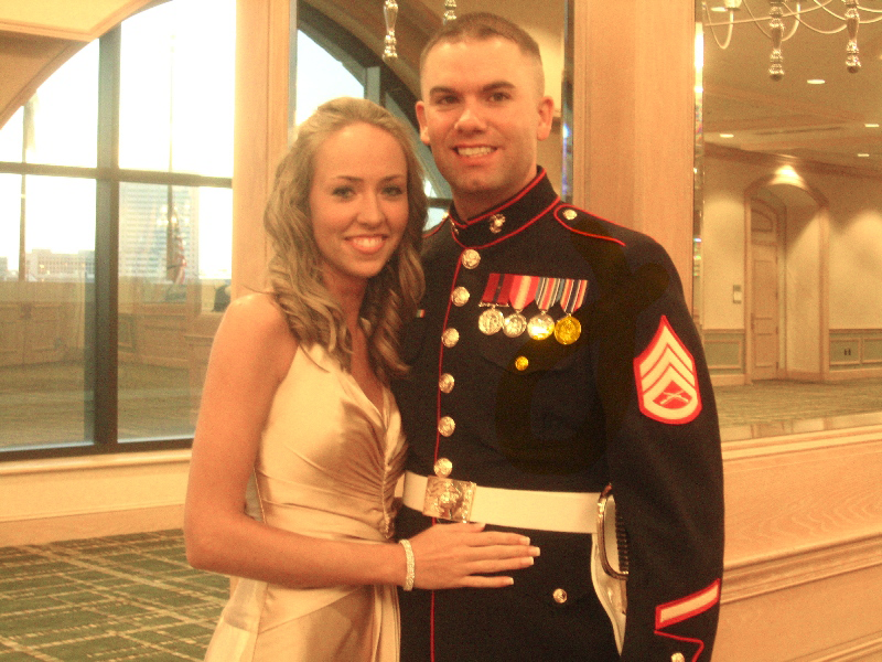 Taylor Dahl military photo in traditional military attire with spouse at event